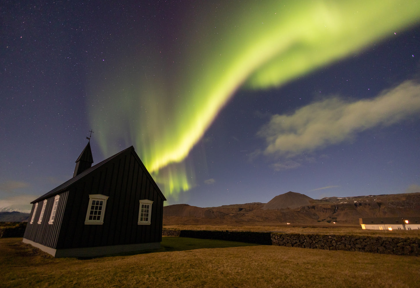 Northern lights over the black church of Búðir, Snæfellsnes